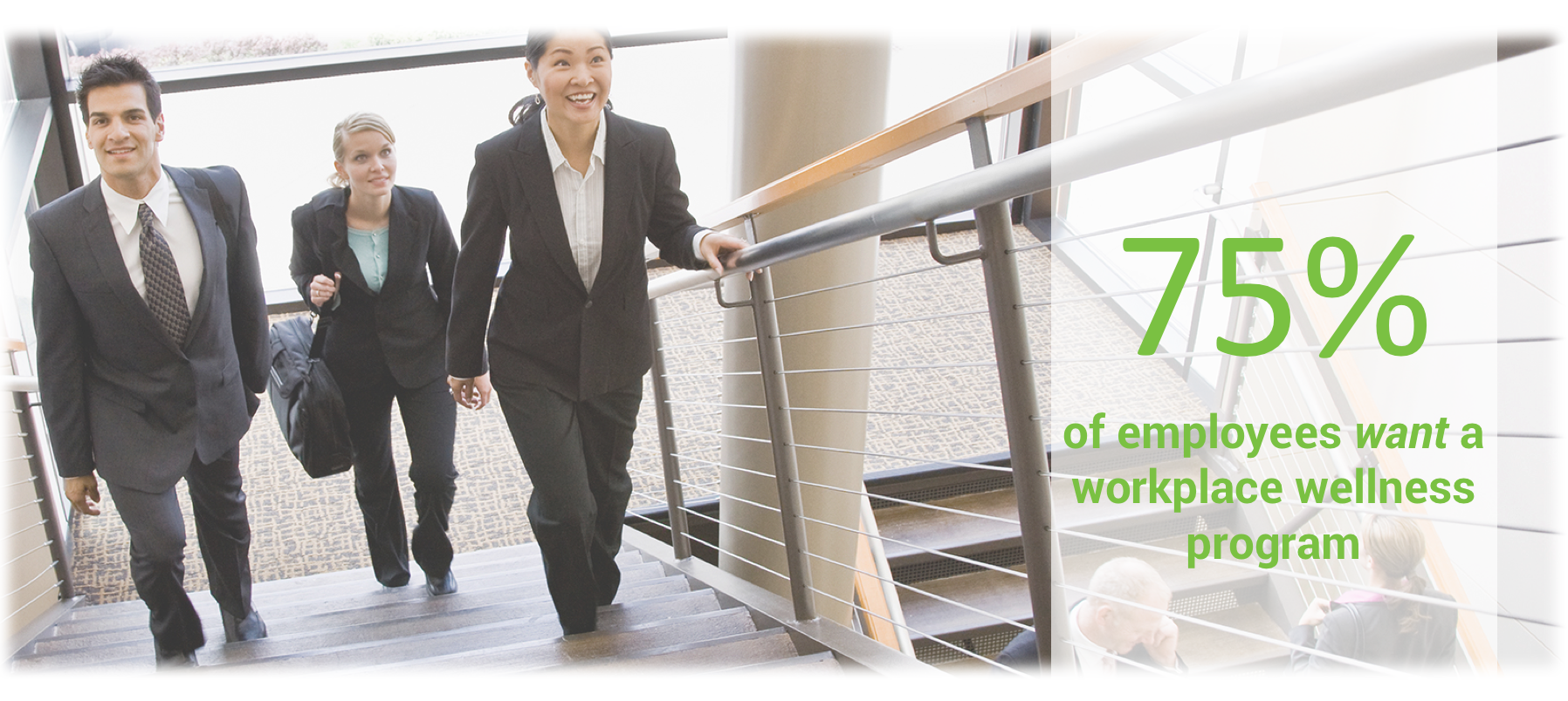Three business professionals climbing stairs in office building